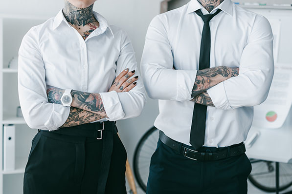 Visible tattoos and non-traditional hair color are now acceptable in more workplaces.